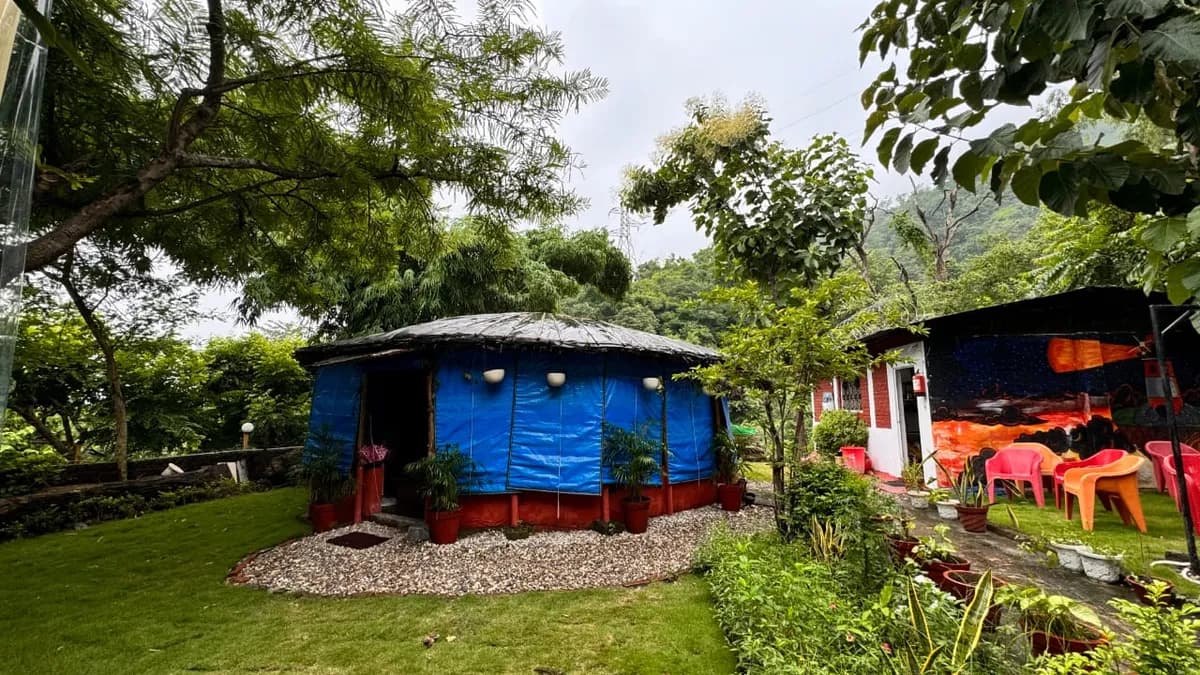 Garden cottages surrounded by trees and Himalayan forest at Swaastik Yog School Rishikesh