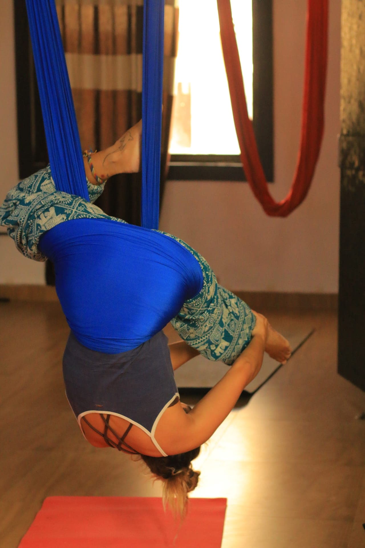 Supported backbend in aerial hammock