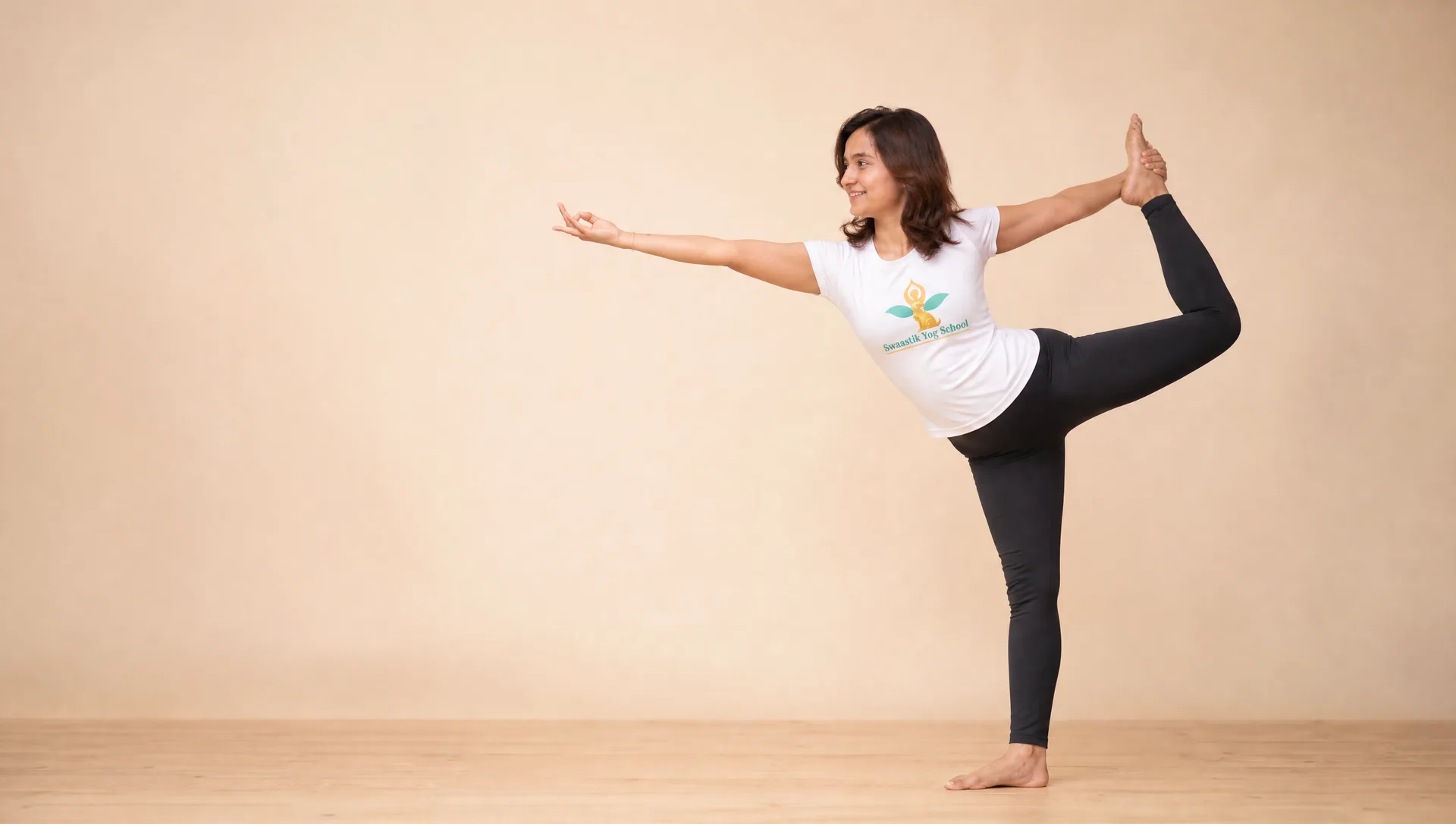 Founder Mayuri demonstrating Natarajasana (Lord of the Dance pose) at Swaastik Yog School's 200 hour yoga teacher training studio