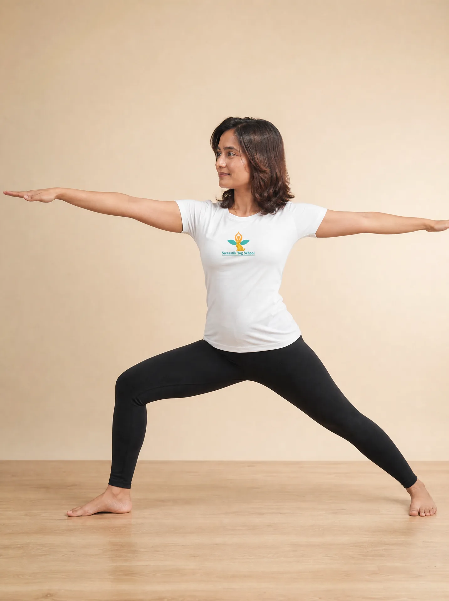 Warrior II pose (Virabhadrasana II) demonstrated by the lead teacher at Swaastik Yog School's 200 hour yoga TTC in Rishikesh