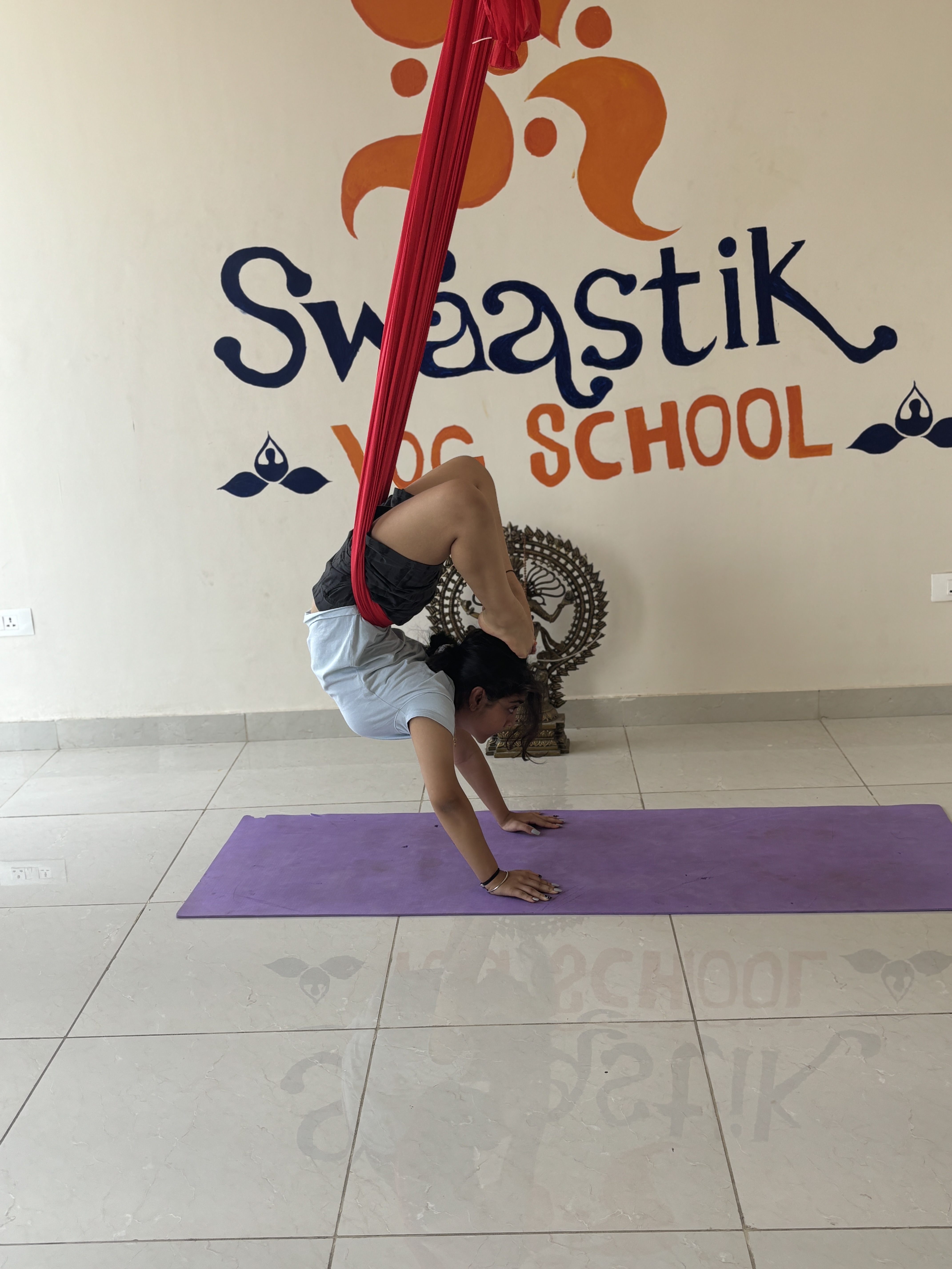 Aerial yoga pose with nature view