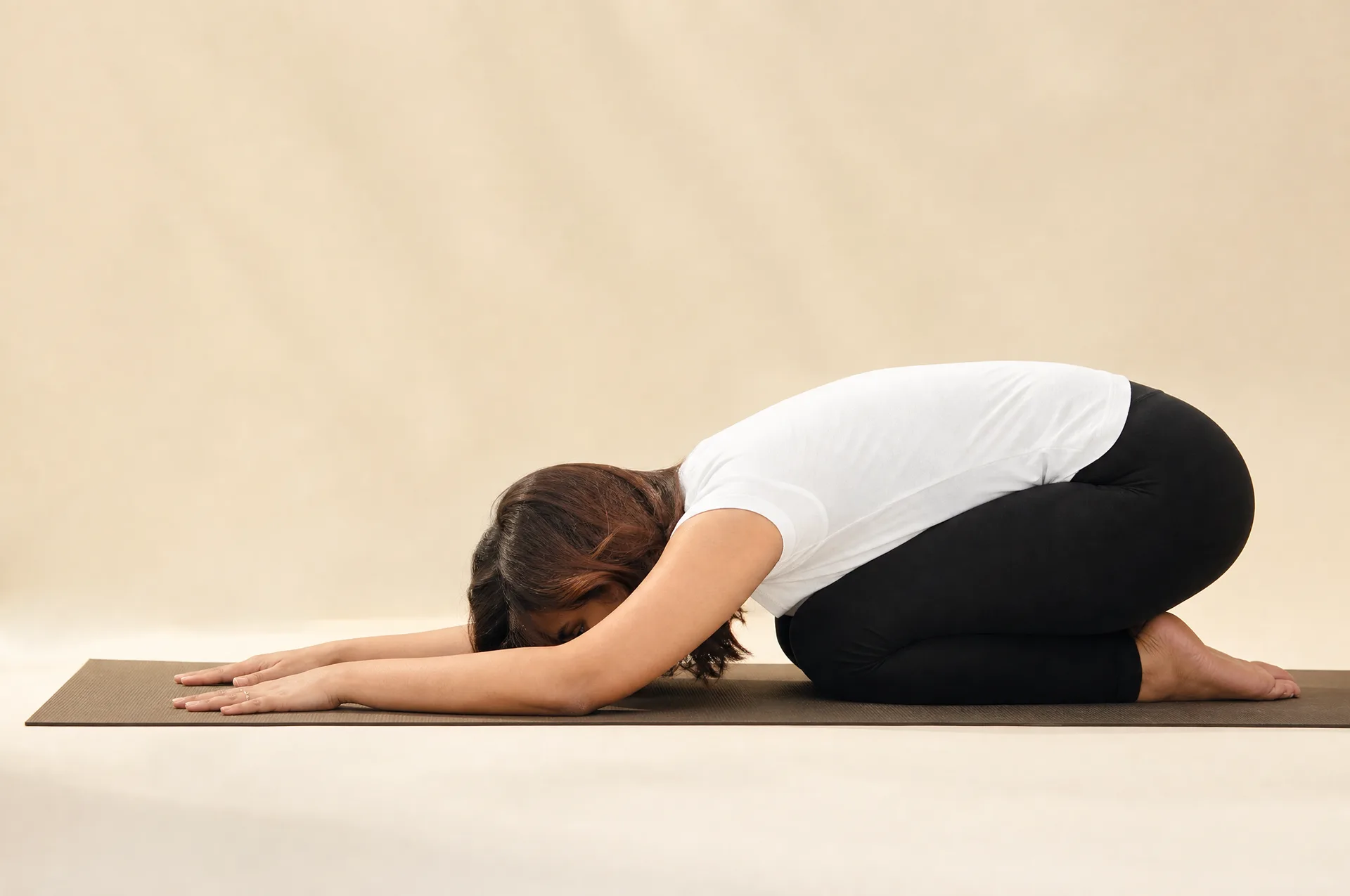 Balasana child's pose, a gentle resting posture that relieves lower back pain